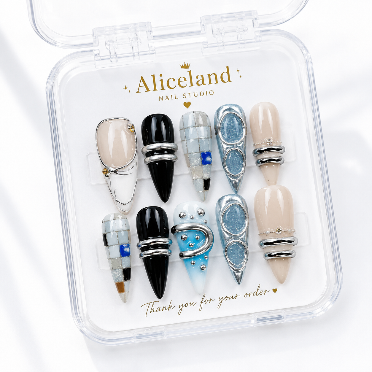 Arctic Chrome almond press on nails with metallic silver, glossy black and icy blue futuristic nail art