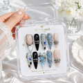 Arctic Chrome almond press on nails with metallic silver and blue futuristic design