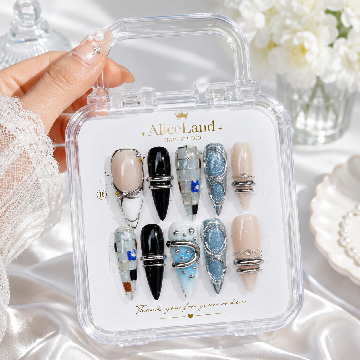 Arctic Chrome almond press on nails with metallic silver and blue futuristic design