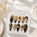 Celestial Noir stiletto press on nails with moon, stars and gothic gold artwork