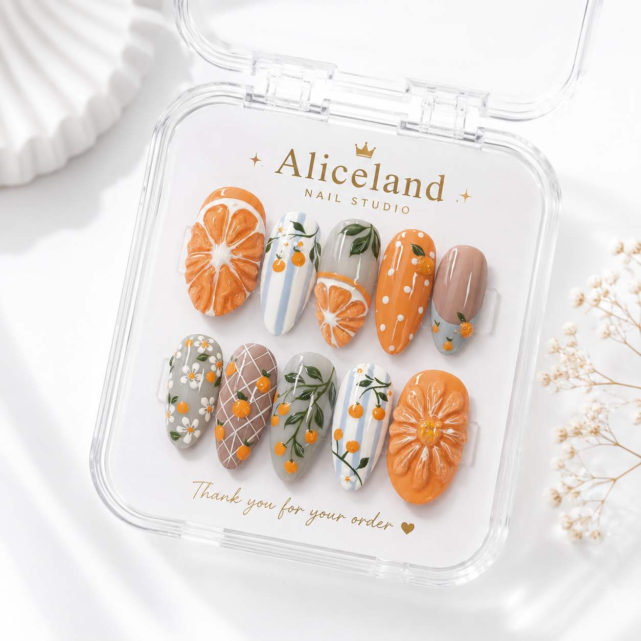 Citrus Bloom almond press on nails featuring 3D orange slices, citrus flowers and Mediterranean-inspired summer nail art