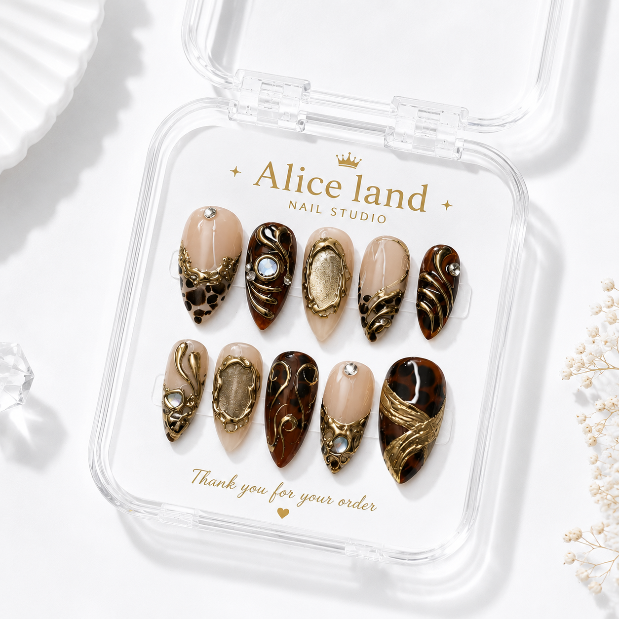Golden Tortoise almond press on nails featuring tortoiseshell patterns with luxury gold chrome accents