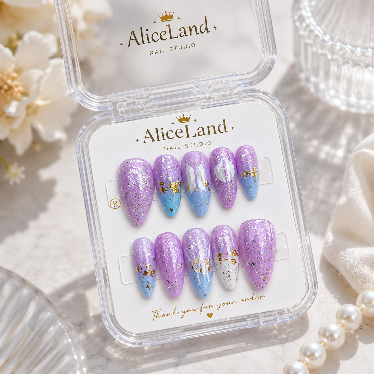 Lavender Dream almond press on nails with butterfly design and pastel glitter finish