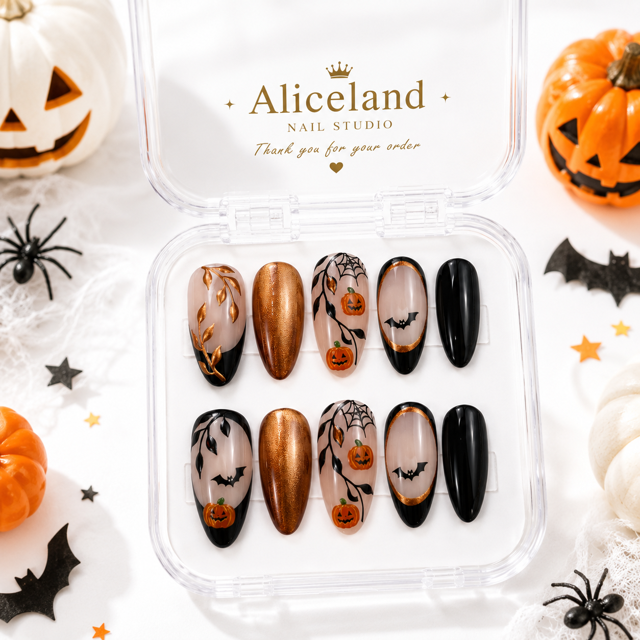 Midnight Pumpkin stiletto press on nails with black French tips, bronze chrome and elegant Halloween nail art