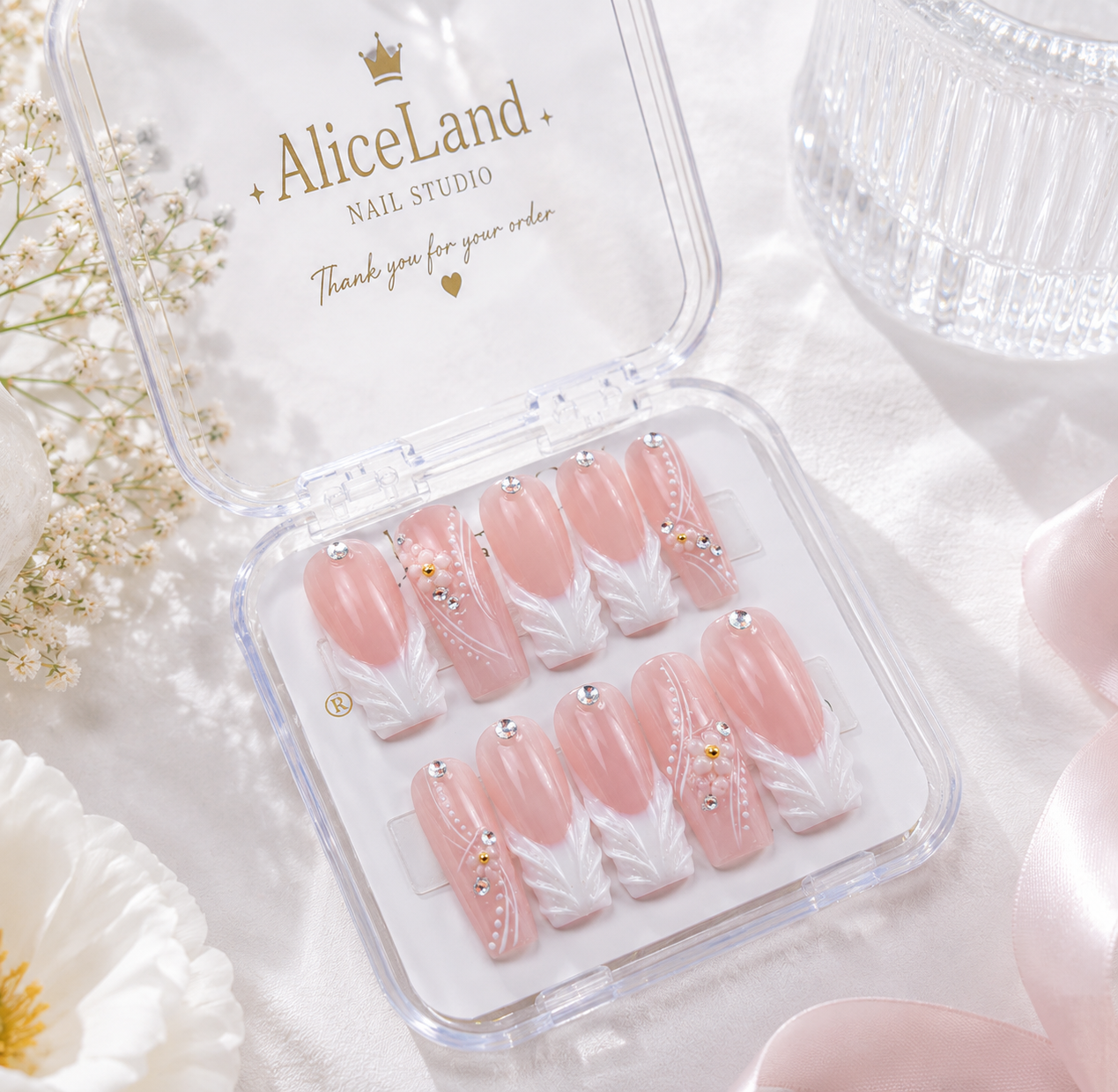 Pearl Whisper almond press on nails with white botanical accents and pearl details