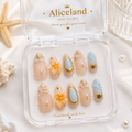 Seashell Blossom almond press on nails featuring 3D flowers, seashell accents, pearls and coastal luxury nail art