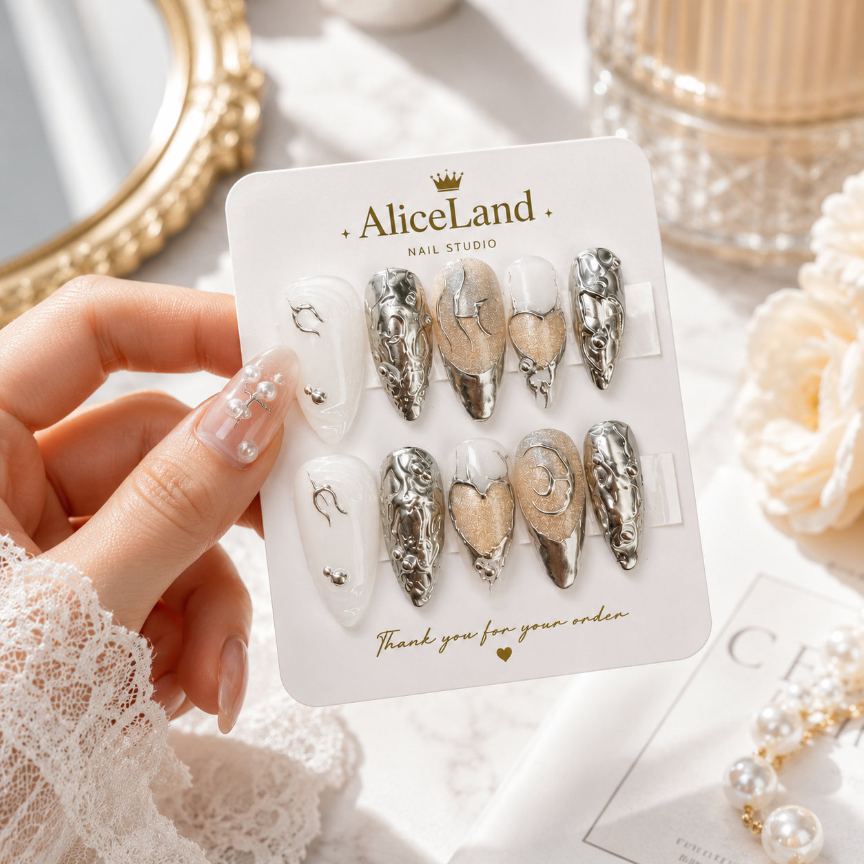 Silver Amour almond press on nails with chrome metallic heart design